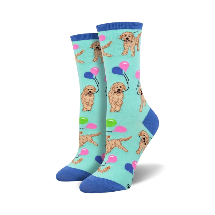 light blue crew socks with a pattern of golden doodle dogs holding strings of balloons in their mouths.  