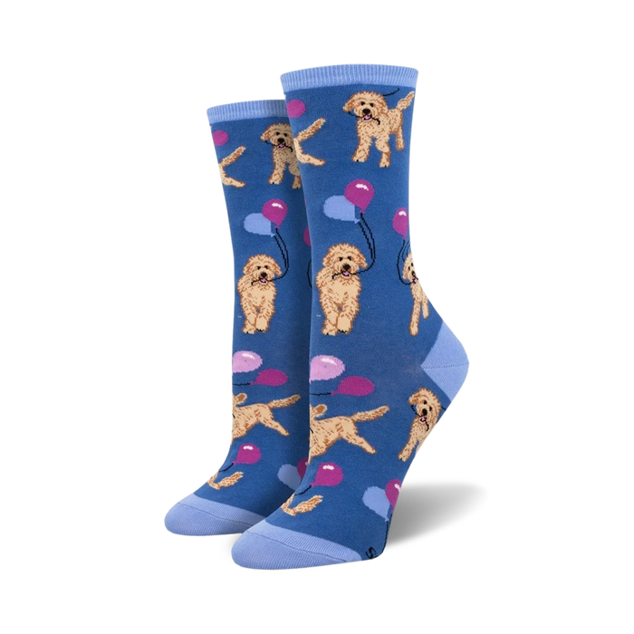crew length women's socks featuring a pattern of golden doodle dogs wearing party hats and holding balloons on a blue background.   