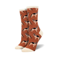 A pair of rust-colored crew socks with a repeating German Shepherd pattern. The socks have a cream-colored cuff.