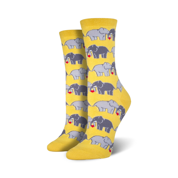 yellow crew socks with gray elephants holding red hearts. women's sock size.  