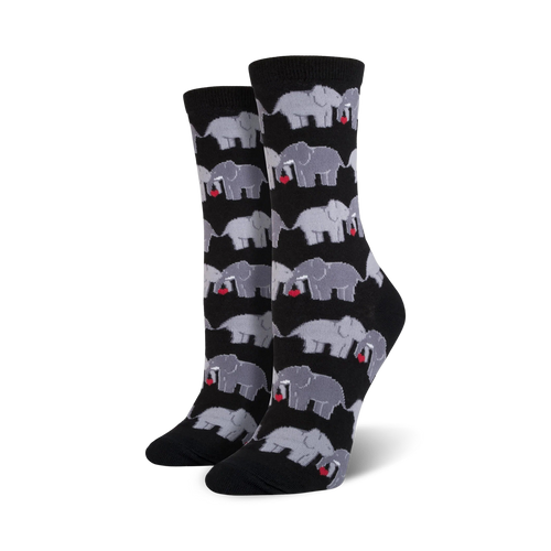 Close-up shot of a pair of black crew socks with a pattern of grey elephants holding hearts.