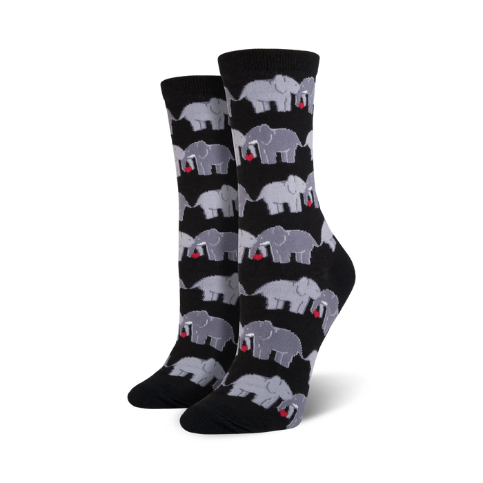 novelty women's crew socks in black with gray elephants holding red hearts in their trunks.   