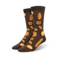 Pair of dark brown crew socks with illustrated pastries: croissants, pretzels, and bread rolls in golden brown hues.