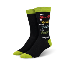 inspirational black socks with rainbow-colored text and green toe and heel. reads "the best way to predict your future is to create it - abe lincoln."  