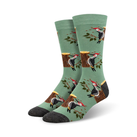 green crew socks with a woodpeckers and tree stump pattern.   