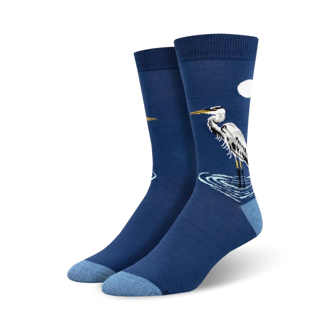 Pair of navy blue crew socks featuring a detailed illustration of a Great Egret standing in water, with a small white cloud in the upper right corner.