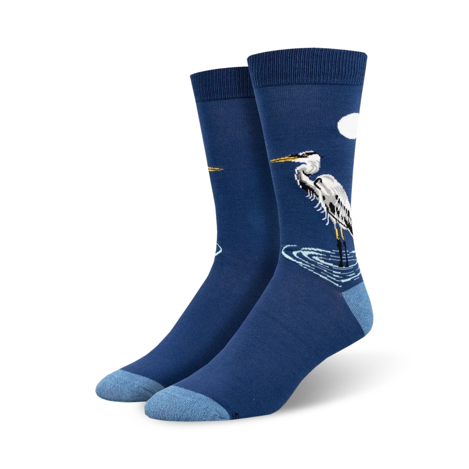 Pair of navy blue crew socks featuring a detailed illustration of a Great Egret standing in water, with a small white cloud in the upper right corner.