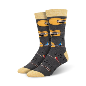 mens yellow-top crew socks feature gray background with brown guitars, blue birds, and musical notes.  