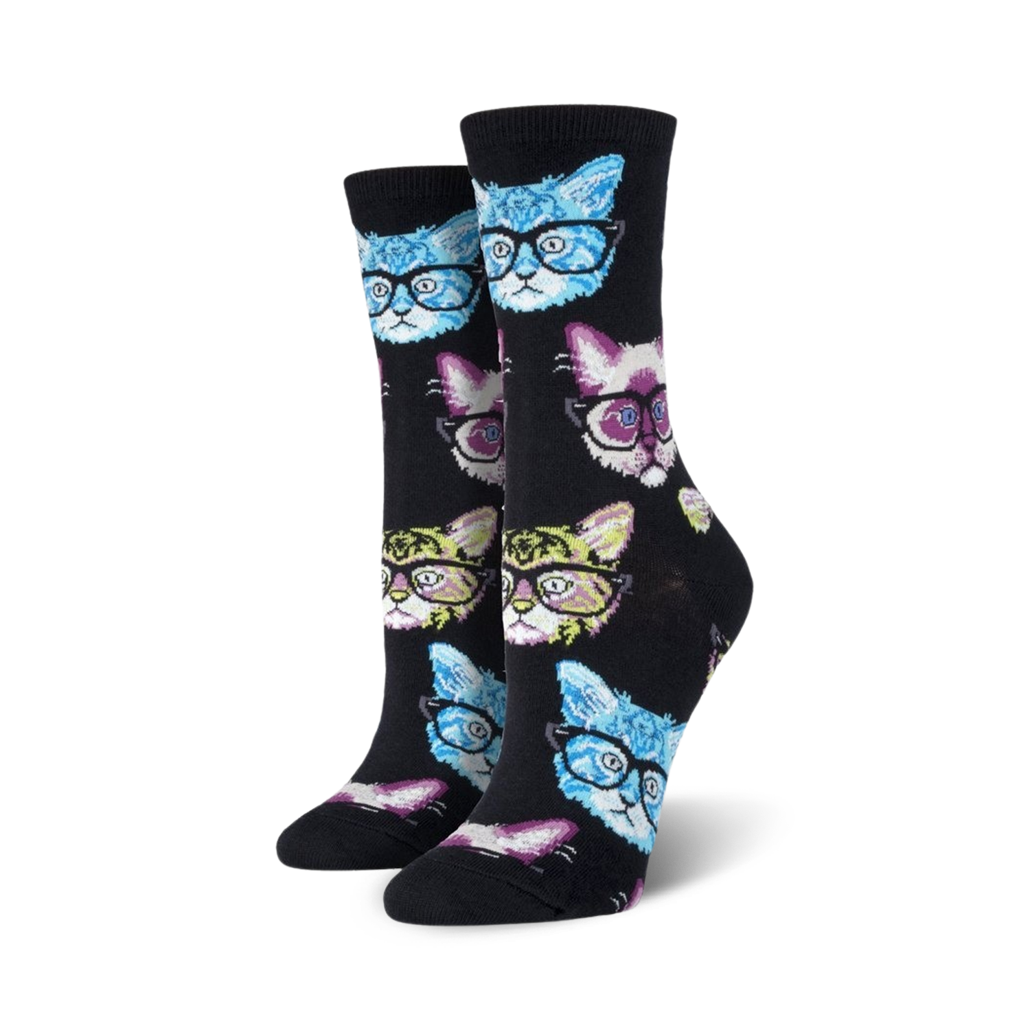 Lifestyle shot of a person relaxing with a book and a cup of coffee, wearing Kittenster socks.