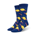 Pair of crew socks in navy blue with a pattern of yellow planets and rings. Stars are scattered on the background. Made of bamboo.