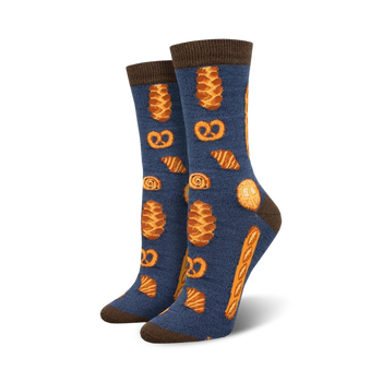 bakery themed crew socks in blue. various baked goods in orange and brown include croissants, pretzels and bread.   