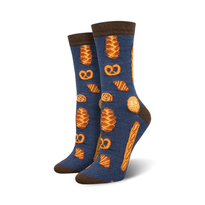 bakery themed crew socks in blue. various baked goods in orange and brown include croissants, pretzels and bread.   