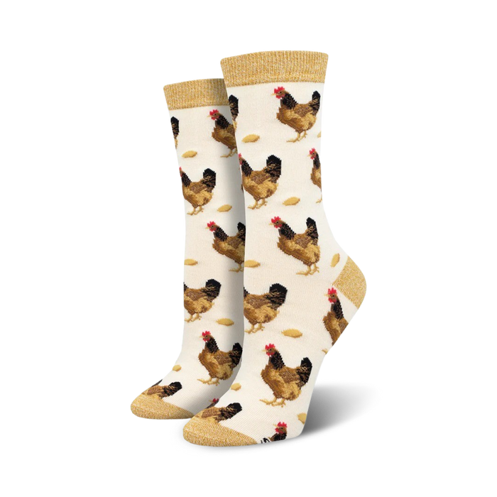 novelty crew socks for women featuring brown hen and egg pattern on cream background with gold accent.   }}