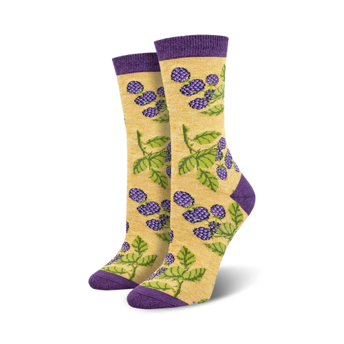 Close-up of a pair of yellow and purple blackberry socks. The socks feature a repeating pattern of blackberries and leaves.