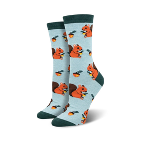 light blue women's crew socks with cartoon squirrels and nuts pattern and a dark green cuff.   