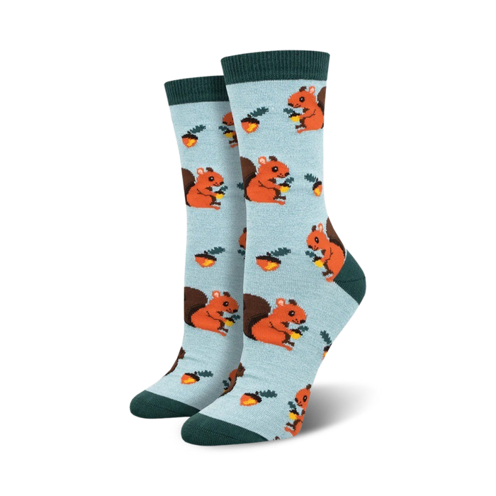 light blue women's crew socks with cartoon squirrels and nuts pattern and a dark green cuff.    }}