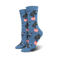 A pair of women's crew socks in blue featuring a pattern of elephants balancing on red and white striped balls.
