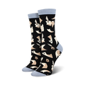 Pair of women's crew socks with a black background and a beige quill and parchment design. The socks have light blue cuffs.