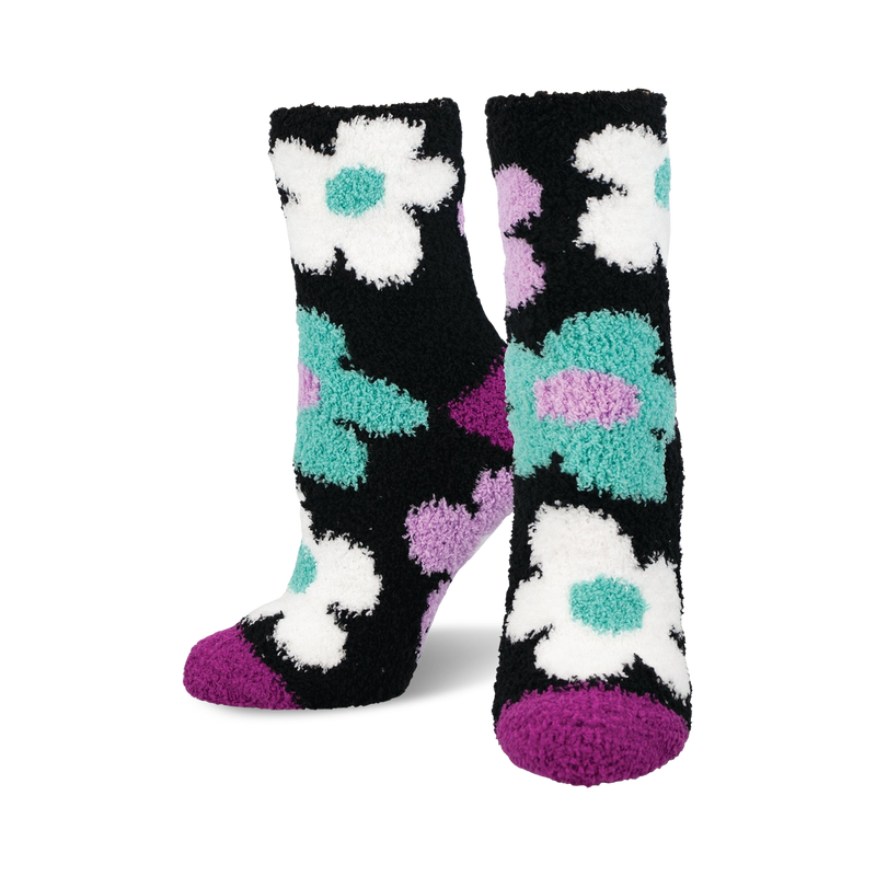 Fuzzy crew socks in black with teal, purple, and white daisies.  Soft and cozy.