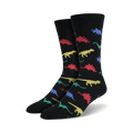 Pair of black crew socks with colorful dinosaur silhouettes.  Red, blue, green, and yellow dinos are playfully scattered across the socks.