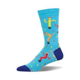 the blue socks have a pattern of yellow, red, and orange inflatable tube men on them. the tube men are arranged in a repeating pattern.