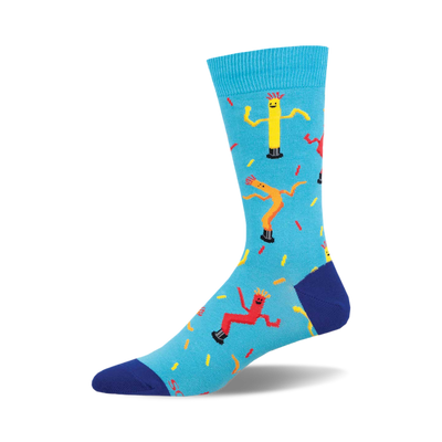 the blue socks have a pattern of yellow, red, and orange inflatable tube men on them. the tube men are arranged in a repeating pattern.