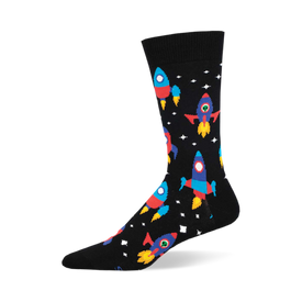 the black socks have a pattern of rockets. the rockets are red, blue, yellow, and green with portholes. there are also white stars and yellow and orange planets.