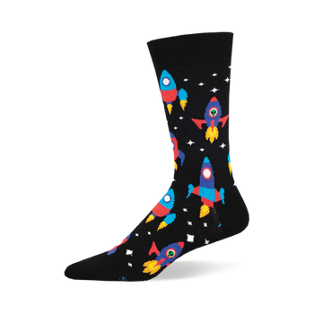 the black socks have a pattern of rockets. the rockets are red, blue, yellow, and green with portholes. there are also white stars and yellow and orange planets.
