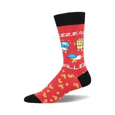 socks that are red with black toes and heels. there is a pattern of yellow cereal rings all over the red part of the sock. there is a bowl of milk on one sock, and a cereal box with a knife in it on the other sock.