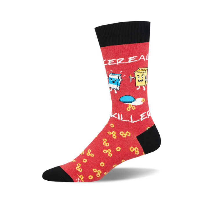 socks that are red with black toes and heels. there is a pattern of yellow cereal rings all over the red part of the sock. there is a bowl of milk on one sock, and a cereal box with a knife in it on the other sock. }}