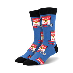 Blue crew socks with repeating red and white cans labeled 'WHOOP ASS' and a yellow burst, on a bent metal design.