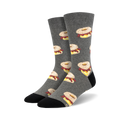 Pair of crew socks in gray with a repeating pattern of illustrated bagels with cream cheese and lox.
