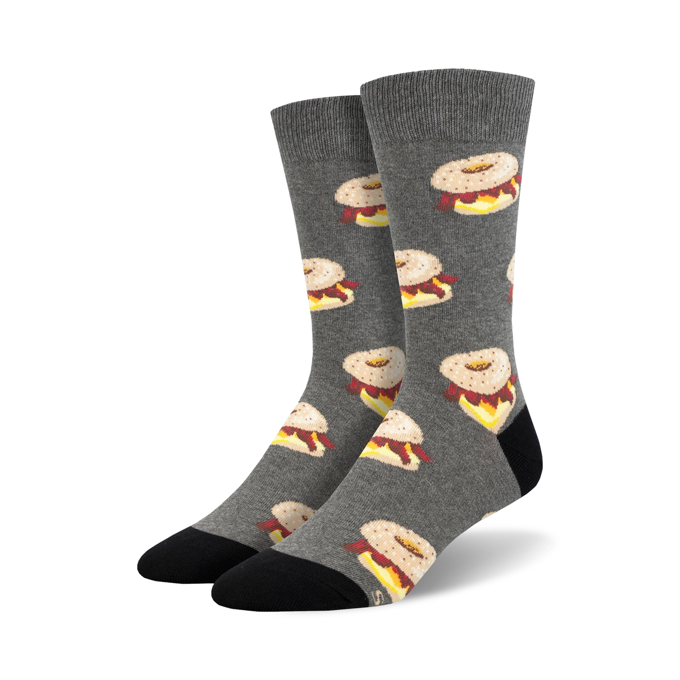 Pair of crew socks in gray with a repeating pattern of illustrated bagels with cream cheese and lox.