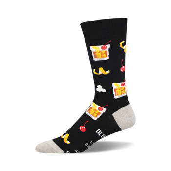 socks that are black with a pattern of lemons, cherries, ice cubes, and glasses with amber liquid.