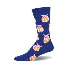 the blue socks have a pattern of pigs wrapped in yellow and white checkered blankets.