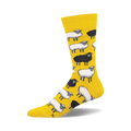 Crew socks featuring a pattern of black and white sheep on a yellow background. 