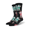 A pair of black crew socks with a repeating pattern of Santa Claus characters surfing.  Santa wears green and red, and the socks have a fun, Christmas-themed design.