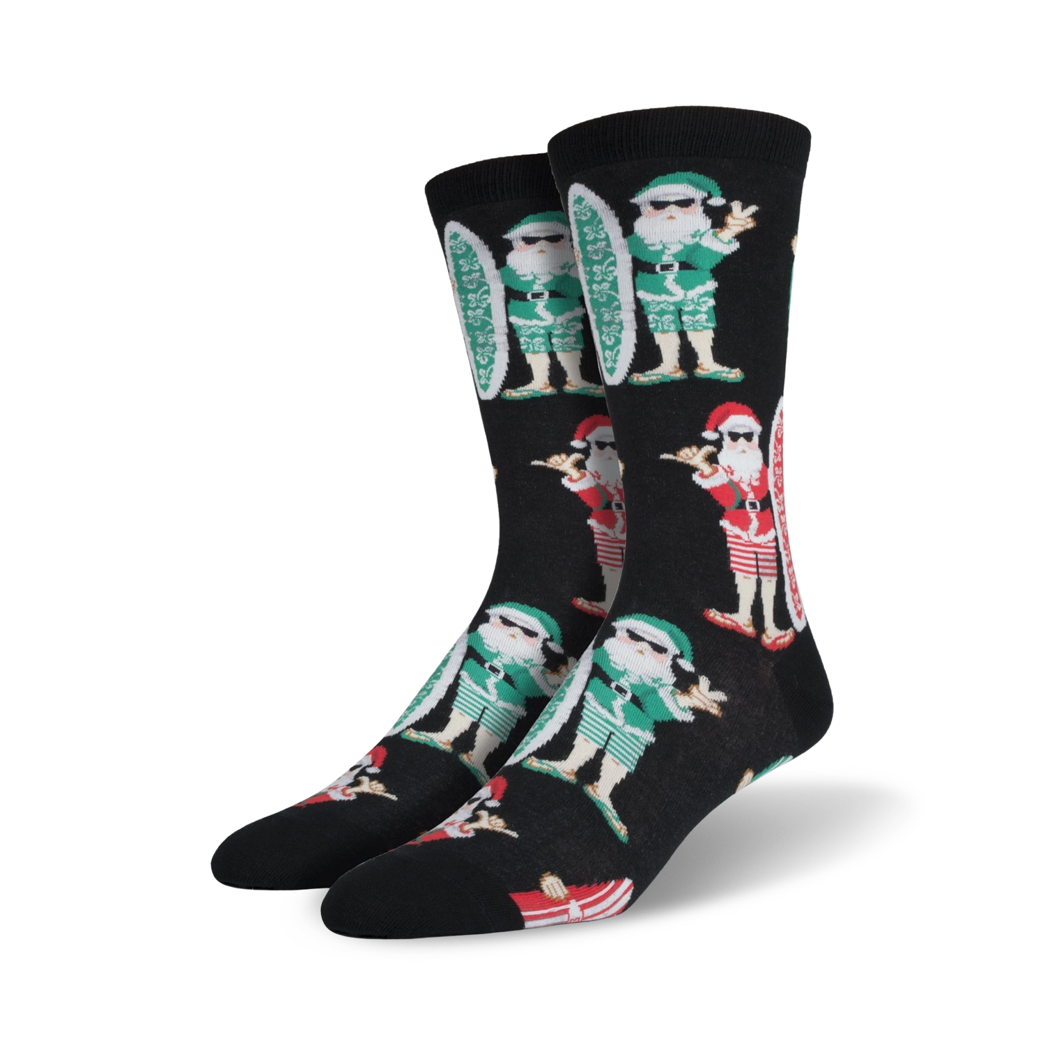 A pair of black crew socks with a repeating pattern of Santa Claus characters surfing.  Santa wears green and red, and the socks have a fun, Christmas-themed design.
