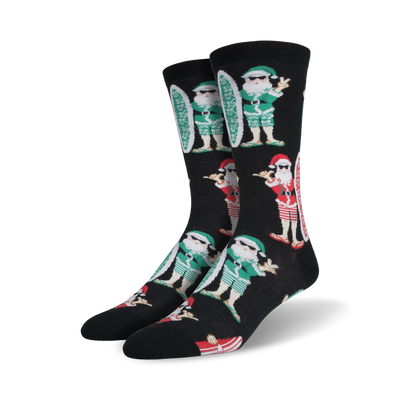 black mens crew socks with santa claus in sunglasses holding a surfboard and performing the "hang loose" hand sign.    