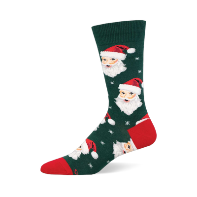 Dark green Christmas sock featuring multiple Santa Claus faces with red hats & white beards, plus white snowflakes. Red toe &