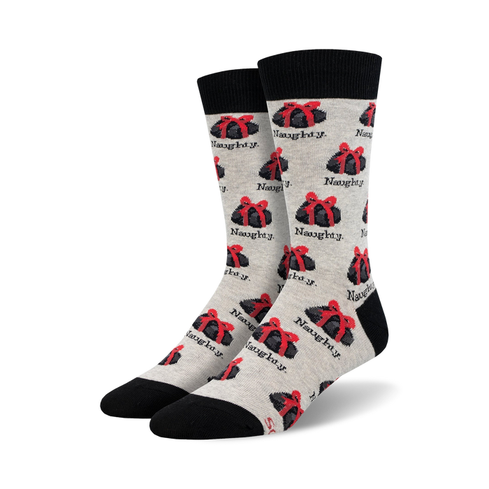 gray crew socks with black toe and heel. red and white candy cane and black present with red ribbons pattern. word 