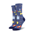 A pair of women's crew socks in blue featuring knitting needles, yarn, and scissors. The design is colorful and fun!