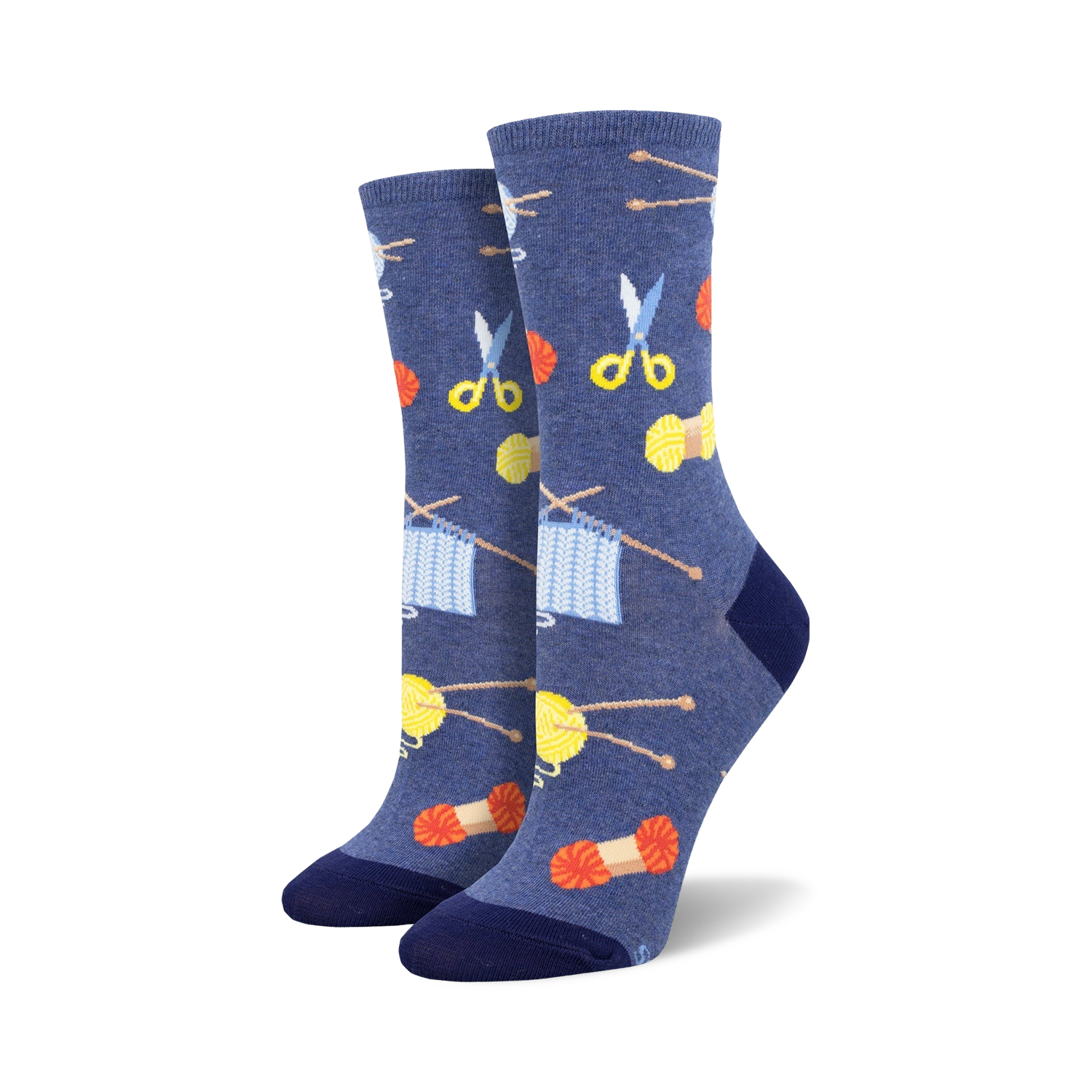 A pair of women's crew socks in blue featuring knitting needles, yarn, and scissors. The design is colorful and fun!