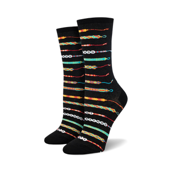 black crew socks featuring a colorful friendship bracelet pattern with the words "best friends" in various hues.  