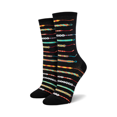 black crew socks featuring a colorful friendship bracelet pattern with the words "best friends" in various hues.  