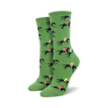 Pair of women's crew socks in green, featuring a repeating pattern of black horses and colorful jockeys.