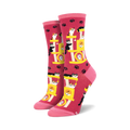 Crew socks in pink featuring a repeating pattern of cats playing on a yellow cat tree. Pink paw prints are scattered across the background.