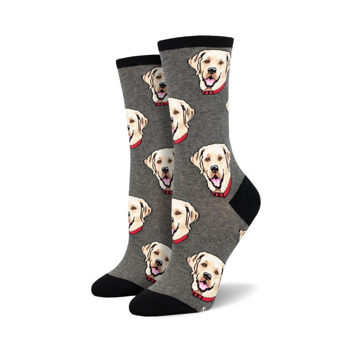 gray crew socks with a vibrant pattern of adorable labrador heads facing different directions and with various expressions.   