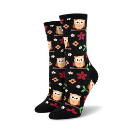 black knee-high crew socks with cartoon owls on green branches for women.  