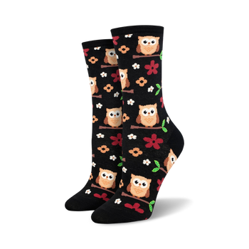 black knee-high crew socks with cartoon owls on green branches for women.  